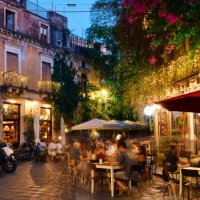 people dining outside restaurants and bars at dusk in catania - food stock pictures, royalty-free photos & images