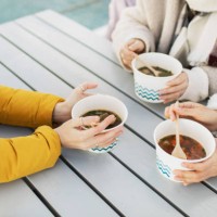 people eating hot soup in cold weather. street food concept. - junk food stock pictures, royalty-free photos & images