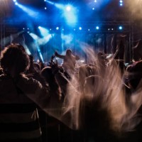people enjoying rock concert, motion blurred headbanging fans - concert stock pictures, royalty-free photos & images
