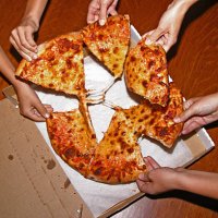 people grabbing slices of pizza, overhead view - food stock pictures, royalty-free photos & images