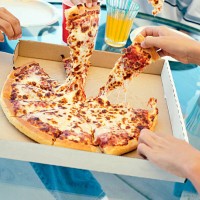 people sharing pizza - junk food stock pictures, royalty-free photos & images