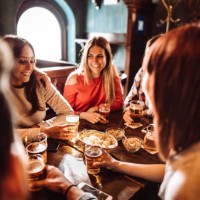 people talking indoors in a pub with the beers - food stock pictures, royalty-free photos & images