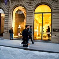people walking in front fendi window display in florence, tuscany, italy - fashion week stock pictures, royalty-free photos & images