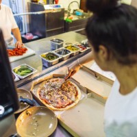 people working in kitchen in fast food restaurant and preparing food for delivery - junk food stock pictures, royalty-free photos & images
