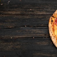 pepperoni pizza on wooden table - junk food stock pictures, royalty-free photos & images