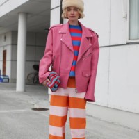 Pernille Rosenkilde is seen wearing a Pink Leather Bikers Jacket with a Multi Coloured Striped Ensemble outside Marimekko show during the Copenhagen...