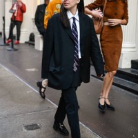 Person is seen wearing a black suit with blue and red striped tie on September 05, 2024 in New York City.