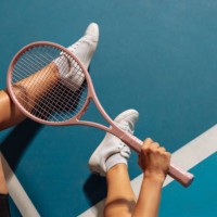 person sitting on a tennis court holding a racquet - fashion stock pictures, royalty-free photos & images