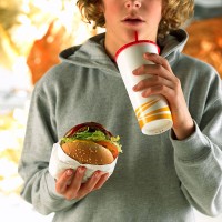 person with fast food - junk food stockfoto's en -beelden