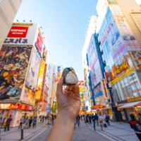personal perspective of person eating onigiri in tokyo, japan - food stock pictures, royalty-free photos & images