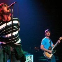 Photo of Liam GALLAGHER and Noel GALLAGHER and OASIS; Noel Gallagher and Liam Gallagher performing live onstage at Ancienne Belgique