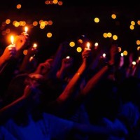 Photo of LIGHTERS and LIGHT SHOWS. Cagarette lights being held in the air at a rock concert in The Netherlands circa 1990.