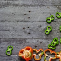 photo of sliced peppers over wooden table - garden decoration stock pictures, royalty-free photos & images