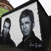 Photograph taken on September 2, 2024 shows a mural created by artist Scott Wilcock aka Snow Graffiti, depicting Liam Gallagher and Noel Gallagher...