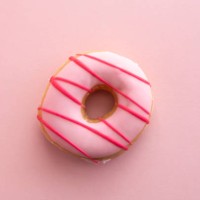 pink striped doughnut - junk food stock pictures, royalty-free photos & images