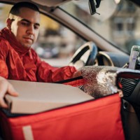 pizza delivery man in a car - junk food stock pictures, royalty-free photos & images