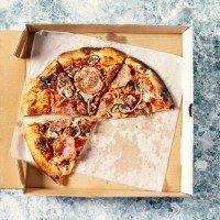 pizza in a box on gray, stone background - junk food stock pictures, royalty-free photos & images