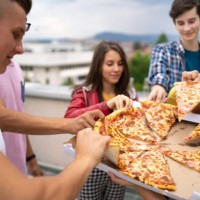 pizza time with friends - junk food stock pictures, royalty-free photos & images