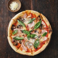 pizza with ham, mozzarella, mushrooms, herbs - junk food stock pictures, royalty-free photos & images