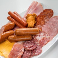 plate filled with unhealthy processed meats and cheese - junk food stock pictures, royalty-free photos & images