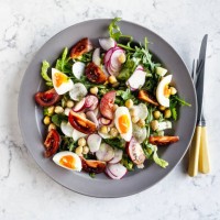 plate of fresh salad with boiled eggs on white background - food stock pictures, royalty-free photos & images