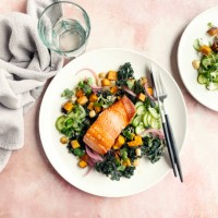 plate of roasted salmon with fresh salad on pink background - food stock pictures, royalty-free photos & images