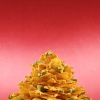 plate piled very high with nachos - junk food stock pictures, royalty-free photos & images