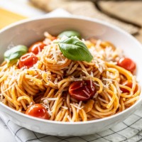 plate with spaghetti in tomato sauce, parmesan cheese and basil. - food stock pictures, royalty-free photos & images