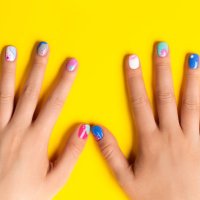 playful abstract art summer manicure in blue and purple colors on bright yellow background - nails art stock pictures, royalty-free photos & images