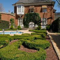 Pond and statutes decorate the French parterre at the Marjorie Merriweather Post mansion at the Hillwood Estate in Washington.