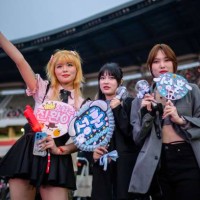 Pop fans pose for a photograph before a K-pop concert as part of the Seoul Festa 2023, at the Jamsil stadium in Seoul, on April 30, 2023.