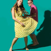 portrait carefree couple dancing against turquoise background - fashion stock pictures, royalty-free photos & images