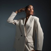 portrait glamorous female fashion model in white blazer - fashion stock pictures, royalty-free photos & images