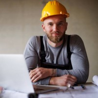 portrait of a confident young man working at construction site - home decoration stock pictures, royalty-free photos & images