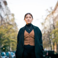 portrait of a confident young woman standing on city street - fashion stock pictures, royalty-free photos & images