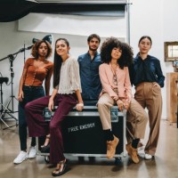 portrait of a creative group of people in a modern loft with photographic equipment in the background - fashion stock pictures, royalty-free photos & images