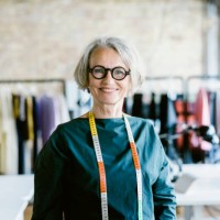 portrait of a happy senior woman fashion designer at her studio - fashion stock pictures, royalty-free photos & images