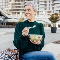 portrait of a happy woman on a lunch break - junk food stock pictures, royalty-free photos & images
