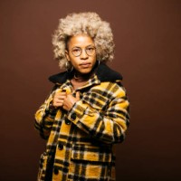 portrait of a latin woman against a brown background - fashion stock pictures, royalty-free photos & images