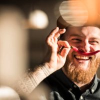 portrait of a man with a red chili moustache - food stock pictures, royalty-free photos & images