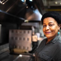 portrait of a mature woman at a commercial kitchen - junk food stock pictures, royalty-free photos & images