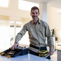 portrait of a plumber or electrician working at a house with his tools - home decoration stock pictures, royalty-free photos & images