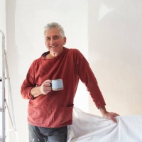 portrait of a senior man who is decorating his bedroom - home decoration stock pictures, royalty-free photos & images