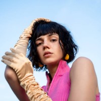 portrait of a young beautiful freckled woman wearing gold satin gloves, fashion and retro style concept. - fashion stock pictures, royalty-free photos & images