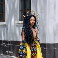 portrait of a young black woman on the street looking at camera - fashion stock pictures, royalty-free photos & images