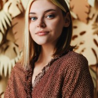 portrait of a young girl on a background with palm leaves. tropical background. portrait of a woman. - fashion stock pictures, royalty-free photos & images