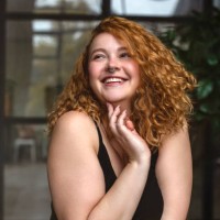 portrait of an attractive and voluptuous young woman posing in background in studio - fashion stock pictures, royalty-free photos & images
