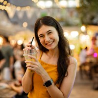 portrait of asian enjoying delicious street food at the street food festival in bangkok. - junk food stock pictures, royalty-free photos & images