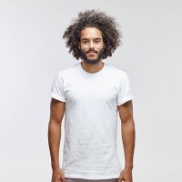 portrait of bearded young man with curly brown hair wearing white t-shirt - hairstyle photos et images de collection