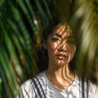 portrait of beautiful woman with palm tree leaves - fashion stock pictures, royalty-free photos & images